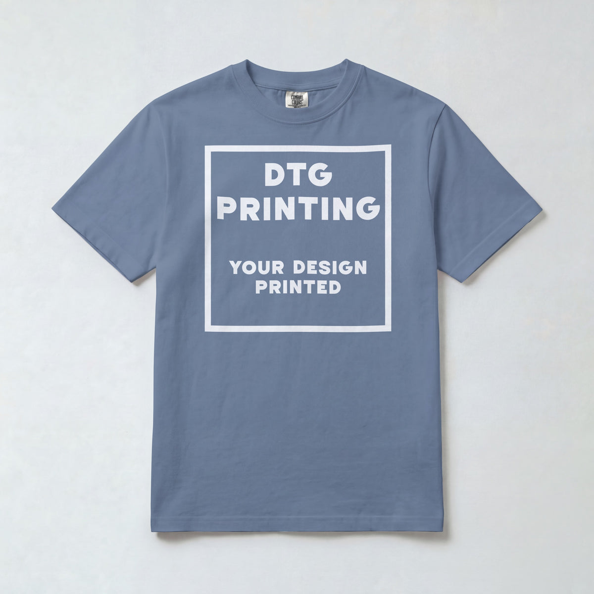 Custom Comfort Colors 1717 t-shirt in Blue Jean with a sample white-ink DTG print