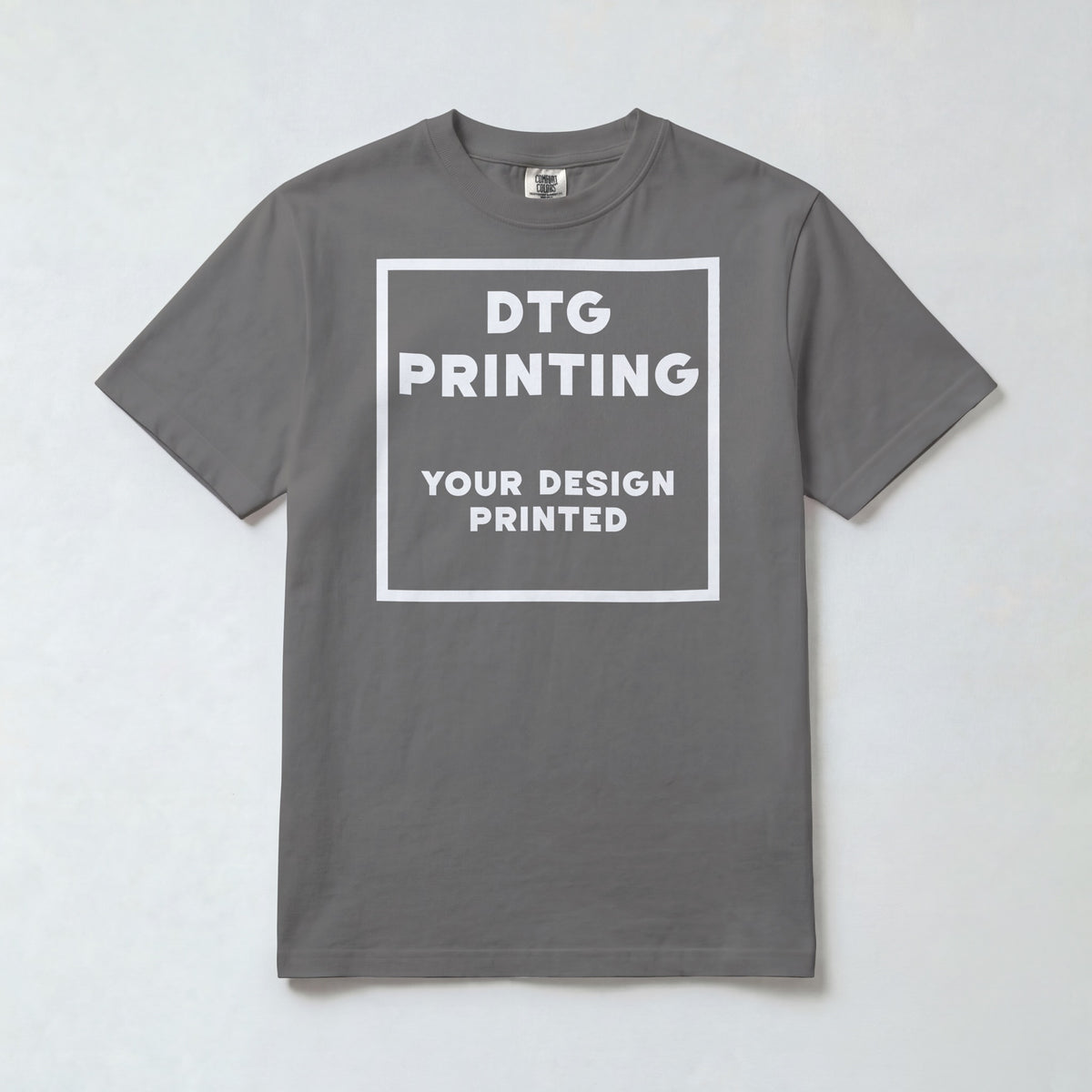 Custom Comfort Colors 1717 t-shirt in Grey with a sample white-ink DTG print