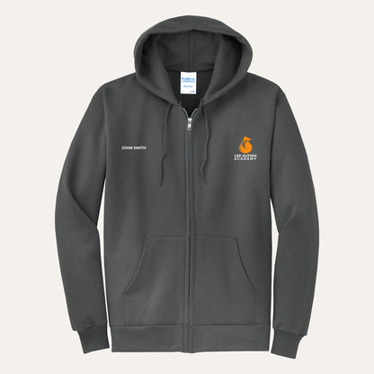 Charcoal adult full-zip hoodie with the orange Lee Autism Academy fox logo on the left chest and a custom name on the right chest